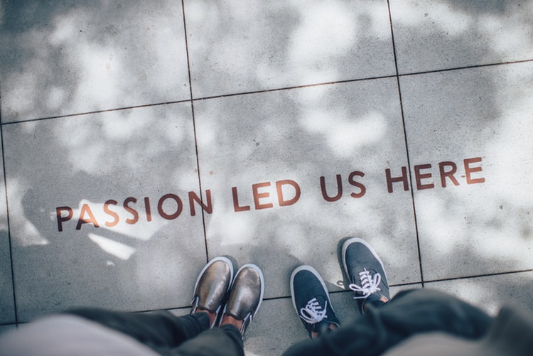 Passion led us here quote written on the ground